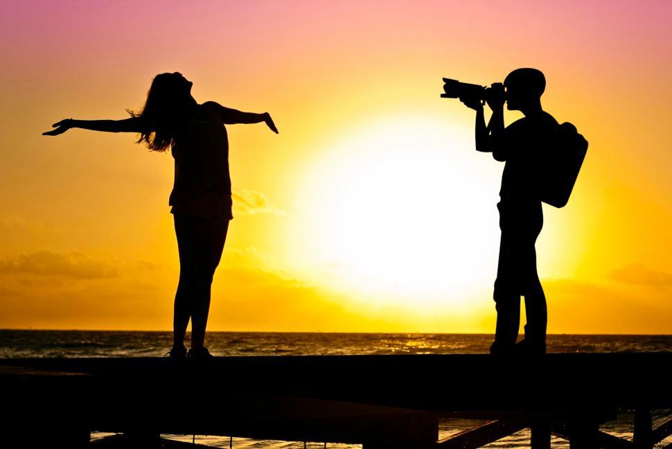 man-taking-pictures-of-girl